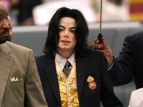 FILE - In this May 25, 2005 file photo, Michael Jackson arrives at the Santa Barbara County Courthouse for his trial in Santa Maria, Calif. A settlement has been reached in a lawsuit between Tohme Tohme, a former manager of Michael Jackson, and his estate. The settlement announced Thursday, May 23, 2019, ends one of the last remaining legal fights involving Jackson's estate and comes just short of the 10th anniversary of the pop superstar's death.