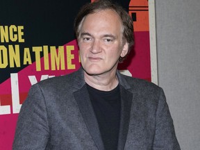 FILE - This April 24, 2018 file photo shows Quentin Tarantino at CinemaCon in Las Vegas, Nev. Tarantino's  "Once Upon a Time in Hollywood" was announced as a late addition to the Cannes Film Festival on Thursday. It will premiere in competition at the upcoming French festival, adding one of the summer's starriest, most anticipated films to Cannes' red carpet.
