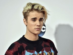 FILE - This Nov. 22, 2015 file photo shows Justin Bieber at the American Music Awards in Los Angeles. YouTube announced Thursday, May 2, 2019, that it is planning a project with the Grammy-winning Canadian pop star, set to premiere next year.