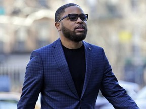 FILE - In this March 5, 2019, file photo, Christian Dawkins arrives at federal court in New York. A jury began deliberating on Monday, May 6, 2019, at the trial of Dawkins, a business manager, and youth basketball coach Merl Code, both accused of secretly bribing assistant college basketball coaches.