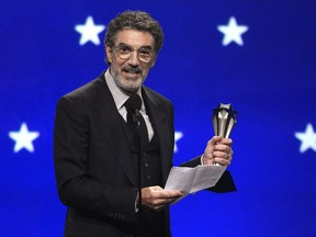 FILE - In this Jan. 13, 2019, file photo, Chuck Lorre accepts the creative achievement award at the 24th annual Critics' Choice Awards at the Barker Hangar in Santa Monica, Calif. The end of "The Big Bang Theory" means the beginning of a familiar debate: is the traditional sitcom, complete with laugh track, a thing of the past? The hit CBS comedy concludes its 12-year run on Thursday, May 16.