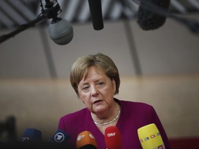FILE - In this Tuesday, May 28, 2019, file photo, German Chancellor Angela Merkel speaks with the media as she arrives for an EU summit in Brussels. Merkel is set to address Harvard University graduates. The Ivy League school is hosting its 368th commencement ceremony Thursday, May 30, with a keynote speech from Merkel.