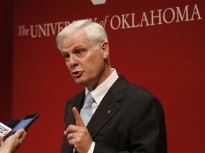 In this June 19, 2018, photo, James Gallogly, President of the University of Oklahoma, speaks following a Board of Regents meeting in Oklahoma City. Gallogly, a former energy industry executive who came out of retirement to succeed David Boren as the university's president, said in a statement released Sunday, May 12, 2019, that he has advised the university's regents of his plans to retire once they have a transition plan in place. He took on the position last year.