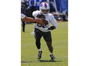 Buffalo Bills running back Senorise Perry (32) gets a handoff during an NFL football organized team activity Tuesday, May 21, 2019, in Orchard Park N.Y.