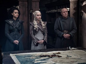 This image released by HBO shows from left, Nathalie Emmanuel, Emilia Clarke and Conleth Hill in a scene from "Game of Thrones," that aired Sunday, May 5, 2019. In the third to last episode of HBO's "Game of Thrones," Mother of Dragons Daenerys Targaryen is suffering from a crisis of confidence. She is short on troops and dragons, short on strategies and short on friends. And her claim to the Iron Throne has weakened upon learning that Jon Snow, in fact, shares her royal Targaryen blood.