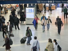 Evening rush hour commuters make their way through the Penn Station concours, Thursday, May 2, 2019 in New York. The increasing challenges posed by the New York area's aging rail infrastructure came into sharp focus Thursday as a congressional delegation prepared to get a firsthand look at the country's busiest station on the same day commuters learned about summer schedule disruptions due to track repairs.