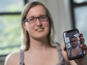 In this Wednesday, May 15, 2019, photo, Bailey Coffman shows her photo as a man in the Snapchat app during an interview in New York. Snapchat's new photo filter that allows users to change into a man or woman with the tap of a finger isn't necessarily fun and games for transgender people. But some others see the potential for such tools to lead to self-discovery among people struggling with their gender identity.