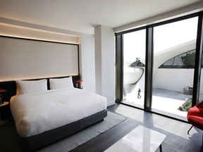 A room at the TWA Hotel at New York's John F. Kennedy International Airport has a view of the Eero Saarinen-designed terminal, Wednesday, May 15, 2019.