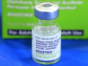 FILE - This Monday, Sept. 19, 2011 file photo shows an empty bottle of tetanus, diphthera and pertussis (whooping cough) vaccine on display at a high school in Sacramento, Calif. On Friday, May 10, 2019, The Associated Press has found that stories circulating on the internet that packaging inserts for diphtheria, tetanus and pertussis vaccines list autism as a possible side effect on the Food and Drug Administration's website, are untrue. The FDA says, "This question of a purported link between vaccines and autism has been exhaustively studied over many years, in dozens of investigations and through some of the largest scientific studies ever undertaken."