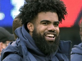 FILE - In this Dec. 30, 2018, file photo, Dallas Cowboys' Ezekiel Elliott smiles on the sideline before an NFL football game against the New York Giants, in East Rutherford, N.J. Elliott was handcuffed by police, but not arrested, after a scuffle involving event staff at a Las Vegas music festival. Police Officer Laura Meltzer said Monday, May 20, 2019 that the 23-year-old running back was detained briefly early Saturday during the Electric Daisy Carnival at the Las Vegas Motor Speedway.