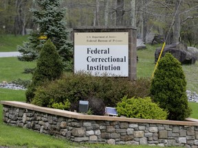 In this May 1, 2019 photo, a sign marks the entrance to the Federal Correctional Institution, Otisville in Mount Hope, N.Y. President Donald Trump's former lawyer and fixer, Michael Cohen, is due to report to the facility on Monday, May 6, 2019, to begin serving a three year sentence for tax evasion, lying to Congress and campaign finance crimes.