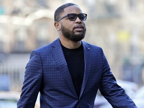 FILE - In this March 5, 2019, file photo, Christian Dawkins arrives at federal court in New York. Dawkins denied on Wednesday allegations that he paid a $2,500 bribe to then-University of South Carolina assistant Lamont Evans. He told a federal jury that the money was meant to pay expenses for the family of South Carolina basketball player P.J. Dozier, a top NBA prospect at the time.