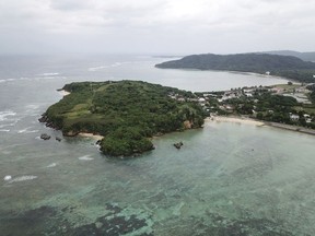 This March 23, 2019 photo provided by Justin Taylan of PacificWrecks.com shows an aerial view of Sonai, Iriomote Jima, Japan. Taylan says airplane wreckage on the ocean floor near the island is from the fighter-bomber flown by 2nd Lt. John McGrath, a U.S. Marine Corps pilot from New York who's still listed as missing in action.