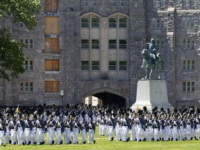 In this May 22, 2019 photo members of the senior class march past a statue of George Washington during Parade Day at the U.S. Military Academy in West Point, N.Y. West Point boosted efforts to recruit women and blacks after being told to diversify in 2013 by then-Army Chief of Staff Gen. Raymond Odierno.