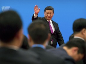 FILE - In this Saturday, April 27, 2019, file photo, Chinese President Xi Jinping waves as he leaves after a news conference on the outskirts of Beijing. Fuming over Washington's latest tariff hike in an escalating trade battle, Beijing has an array of options for retaliating, from limiting exports of rare earths to disrupting operations of Apple and other American companies in China. But they carry economic and political costs. And there is no guarantee they will work.