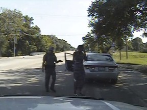FILE - In this July 10, 2015, file frame from dashcam video provided by the Texas Department of Public Safety, Trooper Brian Encinia arrests Sandra Bland after she became combative during a routine traffic stop in Waller County, Texas. Texas authorities are expected to face sharp questioning over why cellphone video Sandra Bland took during her confrontational 2015 traffic stop never publicly surfaced until May 2019.
