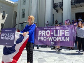 FILE - In this Wednesday, May 22, 2019, file photo, Beck Gerritson, president of Eagle Forum of Alabama, speaks at an anti-abortion rally outside the Capitol in Montgomery, Ala. Even as the anti-abortion movement celebrates passage of sweeping bans in several states, a rift is widening between activists who oppose exceptions for rape and incest, and other abortion opponents, including many Republican politicians, who support those exceptions.