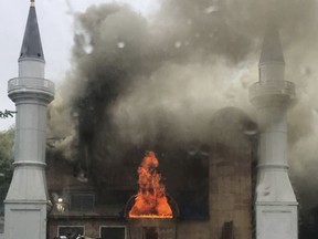 In this photo provided by Lina Biroscak, a fire burns at a mosque, Sunday, May 12, 2019, in New Haven, Conn. It was not immediately clear what caused the fire.
