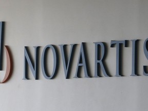 FILE - This Aug. 13, 2016, file photo shows a logo of Swiss pharmaceutical company Novartis in Seoul, South Korea. On Friday, May 24, 2019, U.S. regulators approved Zolgensma, the most expensive medicine ever, a therapy meant to cure a disorder that rapidly destroys a baby's muscle control and kills most within a couple years.