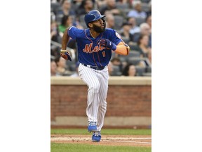 New York Mets' Amed Rosario runs after hitting a home run during the first inning of a baseball game against the Washington Nationals, Monday, May 20, 2019, in New York.