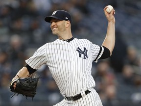 New York Yankees starting pitcher J.A. Happ winds up during the second inning of the team's baseball game against the Seattle Mariners, Thursday, May 9, 2019, in New York.