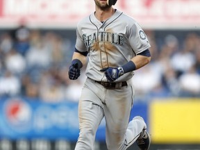 Seattle Mariners Mitch Haniger trots the bases after hitting a solo home run during the third inning of a baseball game against the New York Yankees, Wednesday, May 8, 2019, in New York.