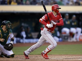 Los Angeles Angels' Shohei Ohtani singles off Oakland Athletics' Frankie Montas in the second inning of a baseball game, Tuesday, May 28, 2019, in Oakland, Calif.