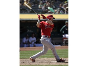 Los Angeles Angels' Jared Walsh follows through on an RBI single against the Oakland Athletics during the ninth inning of a baseball game in Oakland, Calif., Wednesday, May 29, 2019.
