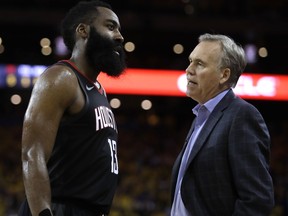 Houston Rockets' James Harden, left, speaks with coach Mike D'Antoni during the second half of Game 5 of a second-round NBA basketball playoff series against the Golden State Warriors Wednesday, May 8, 2019, in Oakland, Calif.