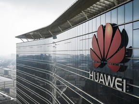 The Huawei Technologies Co. logo is displayed atop an office building at the company's production facility in Dongguan, China, on May 23, 2019.