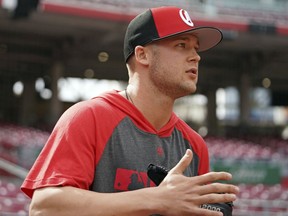Cincinnati Reds' Nick Senzel walks onto the field during batting practice prior to a baseball game against the San Francisco Giants, Friday, May 3, 2019, in Cincinnati, Ohio.