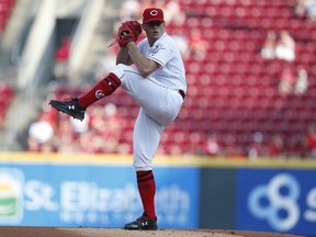 Cincinnati Reds starting pitcher Lucas Sims throws against the Pittsburgh Pirates during the first inning of a baseball game, Tuesday, May 28, 2019, in Cincinnati.