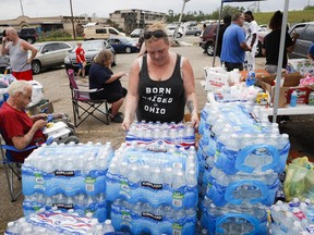 Local volunteers on Wednesday, May 29, 2019, in Dayton Ohio, help organize relief support for victims of a tornado storm system Wednesday Tens of thousands of Ohio residents were still without power or water in the aftermath of strong tornadoes that spun through the Midwest earlier this week.