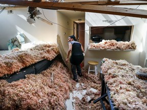 Erica Bohannon leads reporters through her destroyed apartment, Tuesday, May 28, 2019, in Trotwood, Ohio, after a tornado storm system passed through the area the night before, tearing her roof off while she huddled with her son and dog in her bedroom closet.