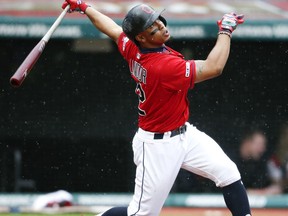 Cleveland Indians' Francisco Lindor hits a one-run double off Chicago White Sox relief pitcher Josh Osich during the fifth inning of a baseball game, Thursday, May 9, 2019, in Cleveland.