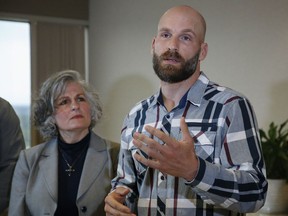 Michael Behenna, right, answers a question during a news conference Wednesday, May 8, 2019, in Oklahoma City. At left is his mother, Vicki Behenna. Behenna has been pardoned from his 2009 conviction for killing an Iraqi prisoner.