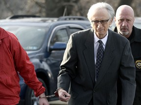 FILE - In this March 18, 2019 file photo, Dr. Johnnie Barto heads into Cambria County Courthouse, in Ebensburg, Pa., for his sentencing in the sexual assault of over two dozen children. A civil suit says a Pennsylvania pediatric practice knew that Barto was a threat to molest young patients but covered it up. The suit says Laurel Pediatric Associates in Johnstown knew at least two decades ago that Barto's patients were in "serious danger," but allowed him to treat - and molest - children, explaining away parents' complaints about his sexual misconduct.