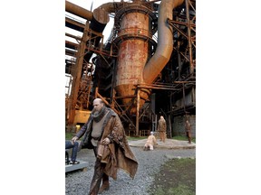 In this Saturday, May 18, 2019, photo actor Jeffrey Carpenter, portraying the character King Lear, performs in the Quantum Theatre production of Shakespeare's tragedy at the site of the old Carrie steel producing blast furnace in Swissvale, Pa. Karla Boos, the artistic director said using this backdrop gives a sense of the enormity of the steel industry and the enormity of its collapse and those are wonderful metaphors for "King Lear."