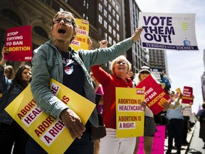 Women's rights advocates demonstrate against recent abortion bans, Tuesday, May 21, 2019, in Philadelphia.