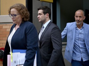 Former Beta Theta Pi house manager Braxton Becker, center, leaves the Centre County Courthouse after being found guilty of one misdemeanor on Thursday, May 30, 2019 in Bellefonte, Pa. Becker was accused of intentionally deleting basement video from the fraternity house after Penn State sophomore Timothy Piazza fell down the steps in 2017.