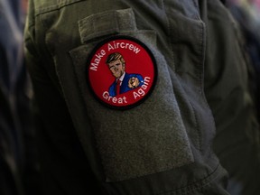 Troops wearing patches that say “Make Aircrew Great Again” during President Trump’s visit Tuesday to the United States amphibious assault ship Wasp in Yokosuka, Japan, on Tokyo Bay.