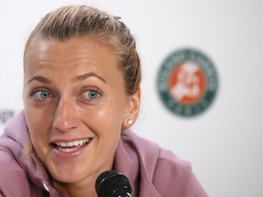 Two-time Wimbledon champion Petra Kvitova answers questions after pulling out of the French Open ahead of her first-round match because of an injured left forearm, at the Roland Garros stadium in Paris, Monday, May 27, 2019.