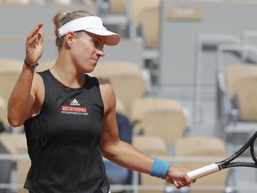 Germany's Angelique Kerber reacts after missing a shot against Russia's Anastasia Potapova during their first round match of the French Open tennis tournament at the Roland Garros stadium in Paris, Sunday, May 26, 2019.