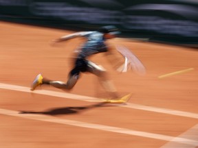 Chile's Nicolas Jarry plays a shot against Argentina's Juan Martin del Potro during their first round match of the French Open tennis tournament at the Roland Garros stadium in Paris, Tuesday, May 28, 2019.