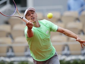 John Millman of the U.S. plays a shot against Germany's Alexander Zverev during their first round match of the French Open tennis tournament at the Roland Garros stadium in Paris, Tuesday, May 28, 2019.