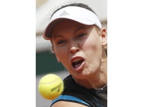 Denmark's Caroline Wozniacki plays a shot against Russia's Veronika Kudermetova during their first round match of the French Open tennis tournament at the Roland Garros stadium in Paris, Monday, May 27, 2019.