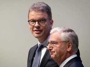 CEO of Deutsche Bank Christian Sewing, left, and head of supervisory board Paul Achleitner are on their way to the annual shareholders meeting in Frankfurt, Germany, Thursday, May 23, 2019.