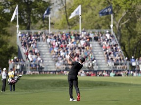 Brooks Koepka hits onto the 12th green during the first round of the PGA Championship golf tournament, Thursday, May 16, 2019, at Bethpage Black in Farmingdale, N.Y.