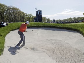 Jordan Spieth hits out of a bunker on the ninth hole during the third round of the PGA Championship golf tournament, Saturday, May 18, 2019, at Bethpage Black in Farmingdale, N.Y.