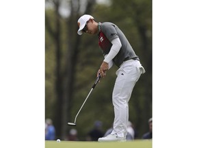 Jazz Janewattananond, of Thailand, putts on the 12th green during the second round of the PGA Championship golf tournament, Friday, May 17, 2019, at Bethpage Black in Farmingdale, N.Y.